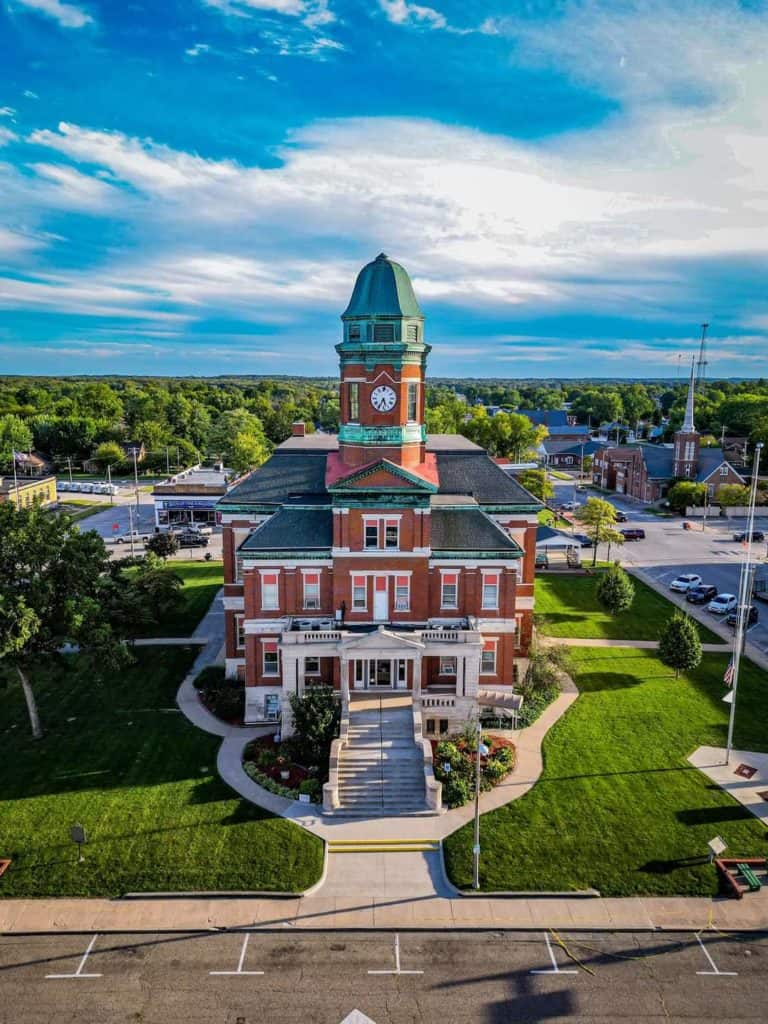 Image of the Lawrence County Courthouse on a bright cheerful sunny day with manicured lawns. 