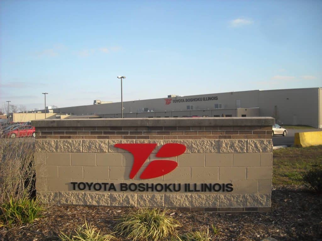 Image of the Red and Black Toyota Boshoku Illinois Facility, clear skies and Toyota is a majoe employer